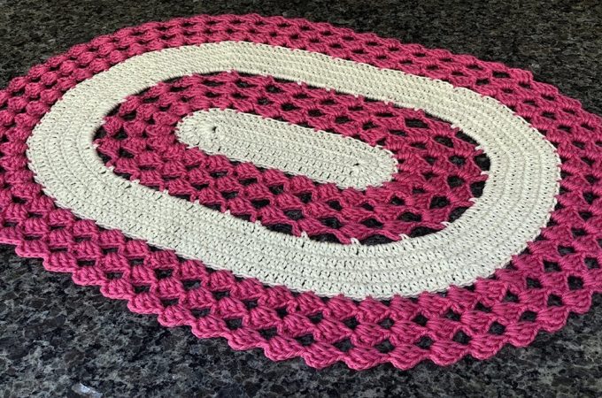 Crochet A Rug Featured Image - Learn how to crochet a rug that is gorgeously detailed. Start making this quick, easy, and economical oval rug to beautify the floors in your home!