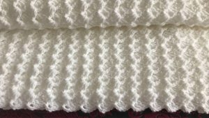 Large Crochet Blanket Featured Image - This tutorial will walk you through this beautiful large crochet blanket. This soft blanket has the most interesting texture of any crochet pattern I have encountered!