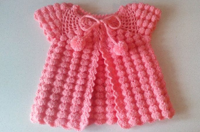 Crochet Baby Dress Featured - Crochet this beautiful baby dress for any special child in your life. This baby dress is so easy and fun to crochet, even if you are a beginner level!