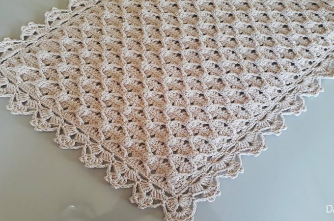 Petite Crochet Rug Featured Image - Learn how to make this petite crochet rug to adorn your room! Watch this tutorial to learn how to make this gorgeously detailed crochet square Rug.