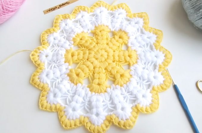 Crochet Puff Stitch Round Doily Featured - Watch this free video tutorial to learn the crochet puff stitch round doily! This crochet puff stitch has a very interesting texture of any crochet pattern I have encountered!