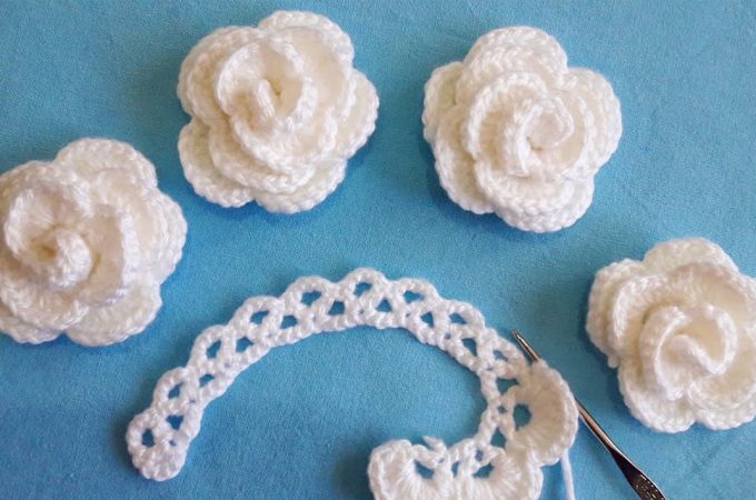 Easy Crochet Rose Featured Image - This gorgeous easy crochet rose is creative and decorative for many projects. Crocheting these roses is a fun project because it's so easy and they make the perfect embellishment for accessories and more!