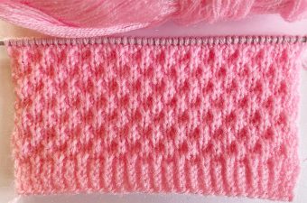 Simple Knit Stitch Featured - Learn how to work this simple knit stitch by watching this tutorial! Keep reading for tips on how you can use this pattern to knit some of all time favorite knitting projects.