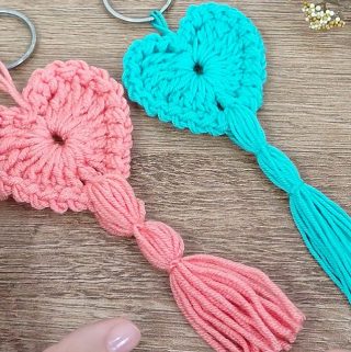 Crochet Heart Keychain Featured - Learn making a unique crochet heart keychain by following this easy pattern. You can make this beautiful accessory in a few hours.