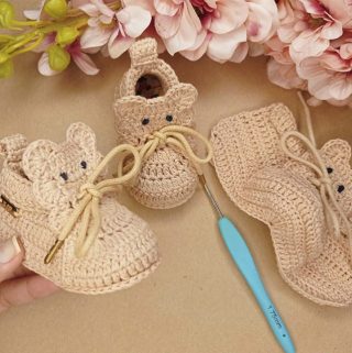 Crochet Newborn Booties Featured - Dive into the delightful world of crochet newborn booties, where artistry meets practicality in the tiniest of packages.