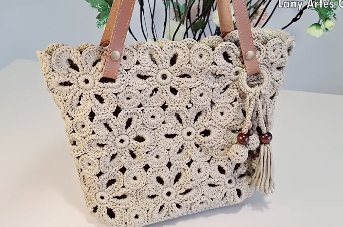Crochet Flower Shaped Bag Featured - Crochet enthusiasts always seek their next creative project, and the crochet flower-shaped bag is a beautiful and practical endeavor.