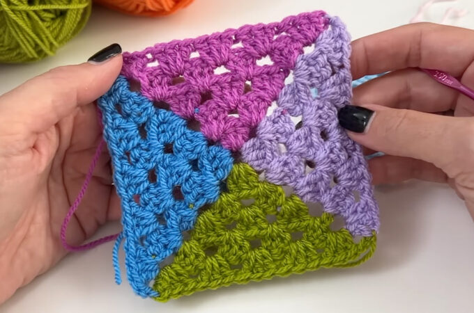 4 Color Granny Square Featured - A 4 color granny square is a delightful way to bring vibrancy, texture, and a touch of personality to your crochet projects.