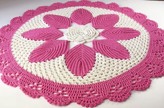 Crochet Daisy Rug Featured - A crochet daisy rug is more than just a floor covering—it's a charming statement piece that brings warmth, elegance, and a touch of nature into any space.