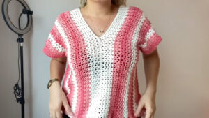 Crochet V Neck Top Featured - There's something magical about the simple elegance of a crochet V neck top. It embodies the spirit of effortless summer days, relaxed creativity, and timeless fashion.