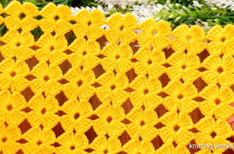 Crochet Floral Motif Featured - If there's one thing that never goes out of style in the world of crochet, it's the timeless charm of crochet floral motifs.