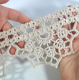 Crochet Lace Edge Featured - There’s something timeless about a well-crafted crochet lace edge. Whether gracing the hem of a tablecloth, a baby blanket, or a vintage-style shawl, these intricate border details whisper elegance and artistry.