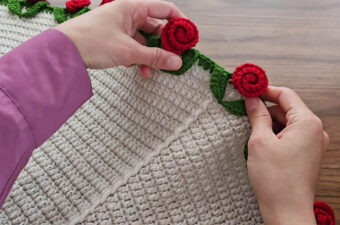 Crochet Throw Blanket Featured - Few projects capture the charm of handmade beauty quite like a crochet throw blanket. Add to that a delicate rose edging, and you’ve got yourself a showstopper — both functional and decorative.