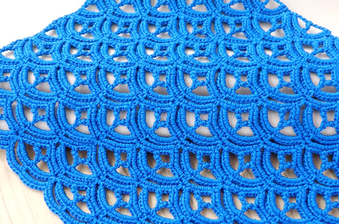 Crochet Fan Openwork Stitch Featured - The crochet fan openwork stitch is a captivating pattern that combines lightness, texture, and visual intrigue. Its scalloped, semi-circular fans create a rhythmic lace effect, making it ideal for airy shawls, decorative blankets, breezy tops, and elegant accessories.