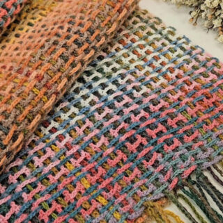 Crochet Woven-Looking Shawl Featured - The crochet woven-looking shawl is a project that combines the cozy feel of crochet with the sleek appeal of woven fabric. There’s something undeniably captivating about a crochet piece that looks woven.